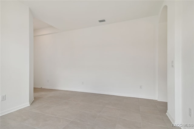 empty room featuring light tile patterned floors