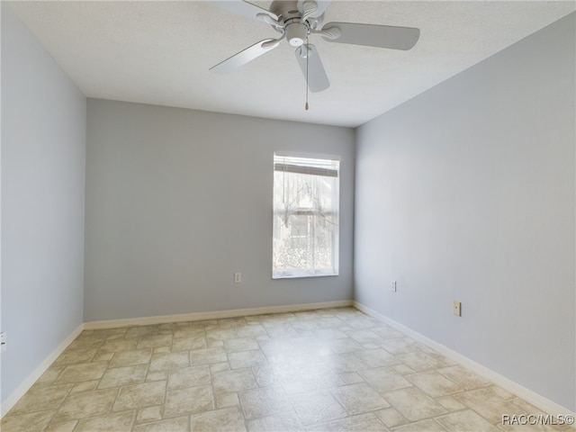 spare room with ceiling fan