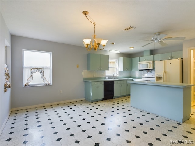 kitchen with sink, white appliances, plenty of natural light, and green cabinetry