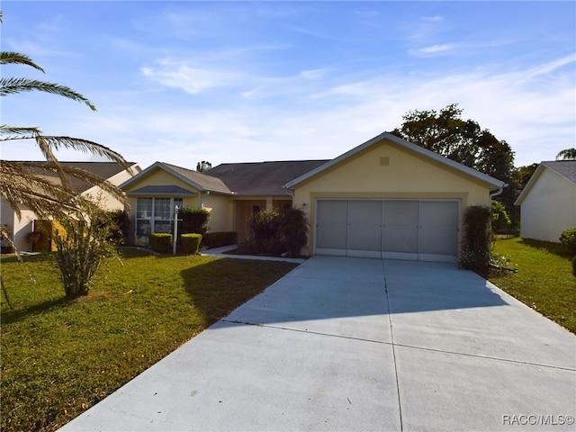 ranch-style house featuring a garage and a front yard