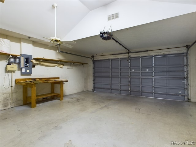 garage featuring a garage door opener and electric panel