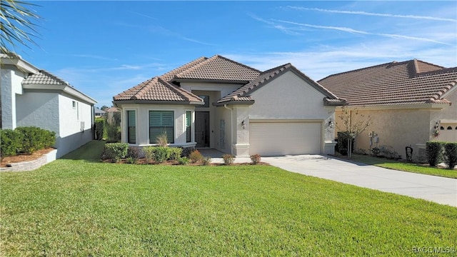 view of front of property featuring a garage and a front lawn