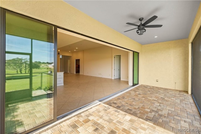 view of patio / terrace featuring ceiling fan