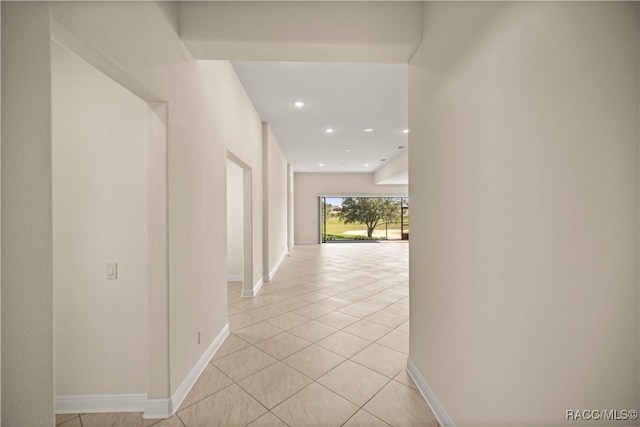 hallway with light tile patterned flooring