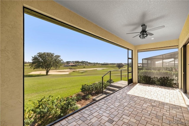 view of patio featuring ceiling fan