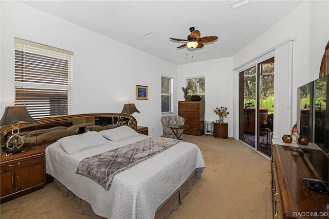 carpeted bedroom with access to outside and ceiling fan