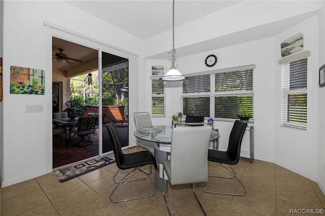 dining room with tile patterned flooring and ceiling fan