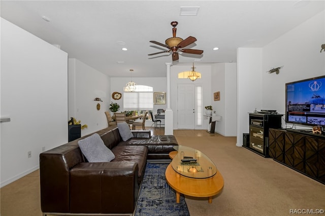 carpeted living room featuring ceiling fan