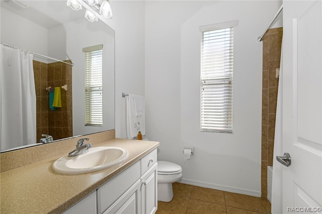 bathroom with tile patterned floors, a shower with curtain, plenty of natural light, and toilet