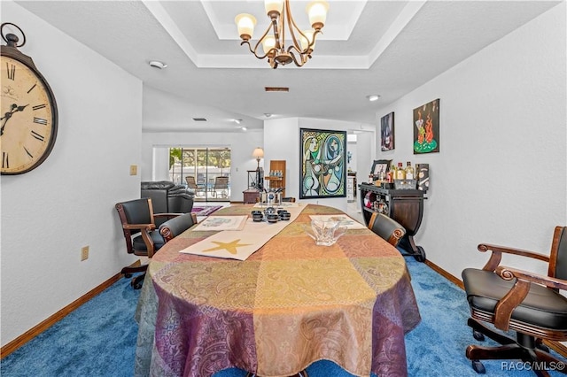 carpeted dining area with a raised ceiling and an inviting chandelier