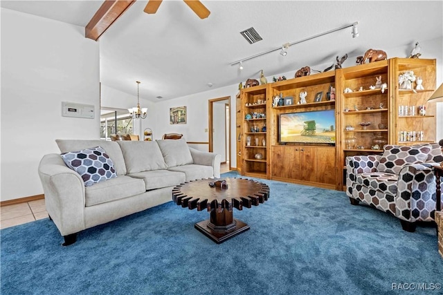 living room featuring lofted ceiling with beams, ceiling fan with notable chandelier, tile patterned flooring, and track lighting