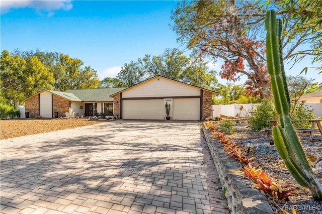 ranch-style home featuring a garage