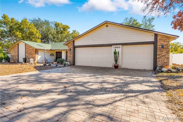 ranch-style home with a garage