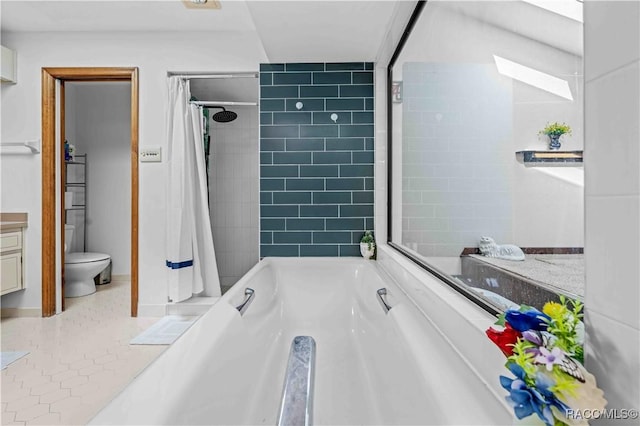 bathroom with tile patterned floors, shower / bath combination with curtain, and toilet