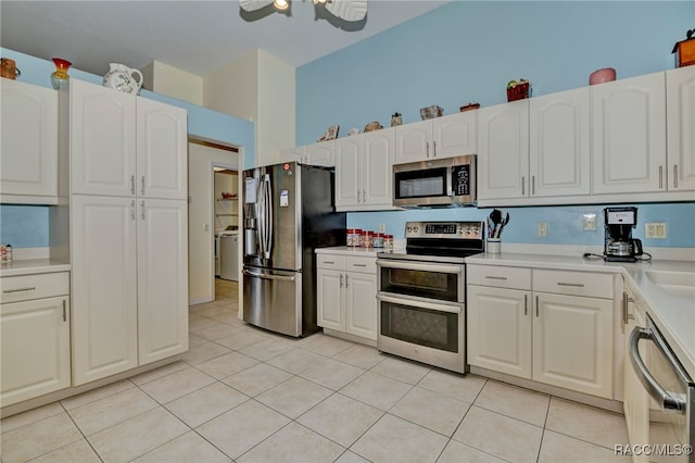 kitchen with ceiling fan, white cabinetry, light tile patterned flooring, and appliances with stainless steel finishes