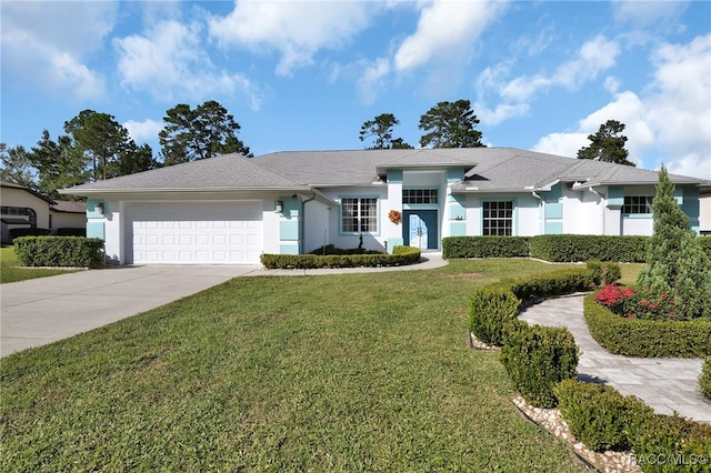 ranch-style home with a garage and a front lawn