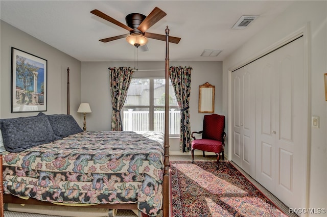 bedroom with carpet, ceiling fan, and a closet