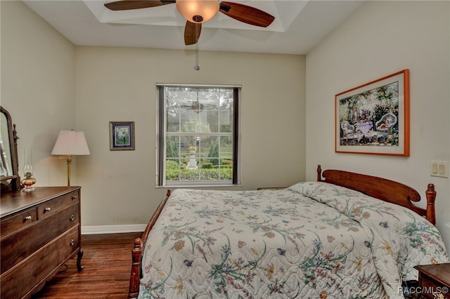 bedroom featuring ceiling fan and dark wood-type flooring