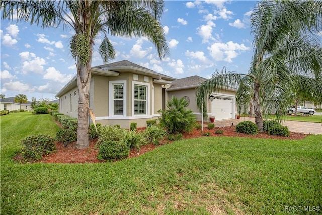 view of front of property with a garage and a front lawn