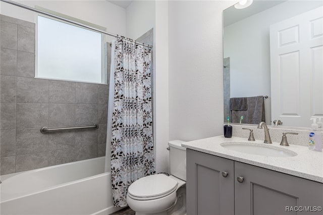 full bathroom featuring vanity, shower / bath combination with curtain, and toilet