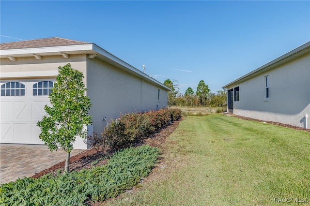 view of yard with a garage