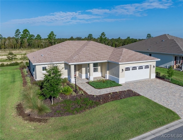 ranch-style home featuring a front yard and a garage