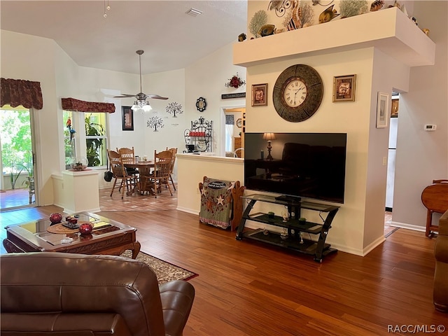 living room with hardwood / wood-style flooring and ceiling fan