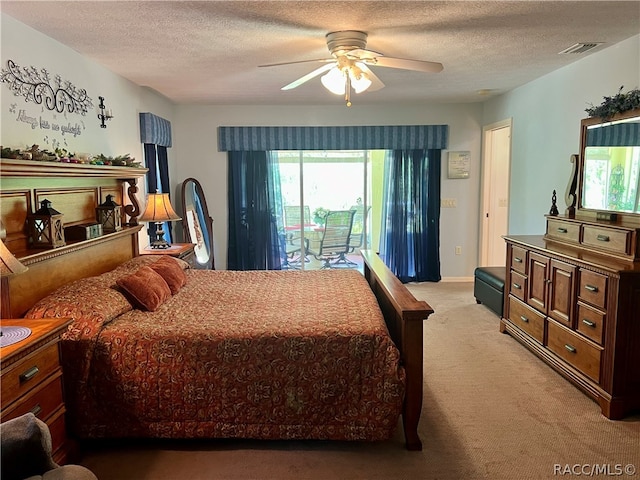 bedroom with access to exterior, ceiling fan, light carpet, and a textured ceiling