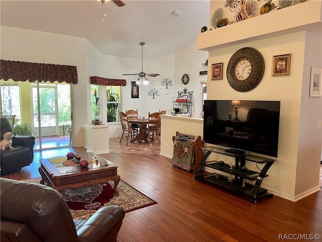 living room featuring dark hardwood / wood-style floors and ceiling fan