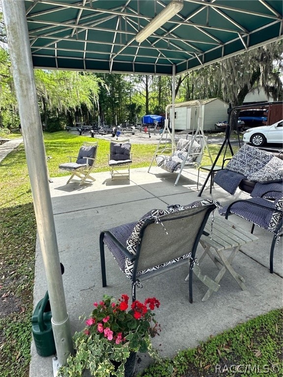 view of patio / terrace with a storage unit