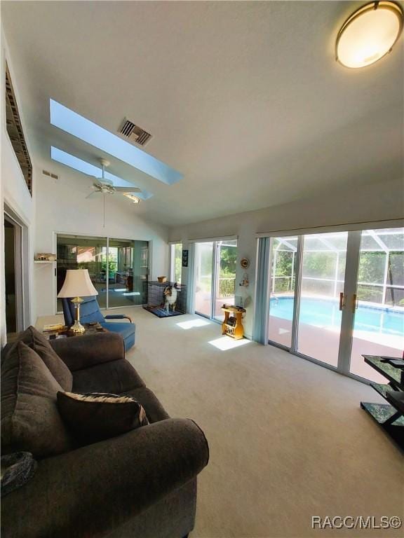 9120 SW 193rd Cir, Dunnellon, FL 34432 - living area featuring carpet flooring, lofted ceiling, and ceiling fan