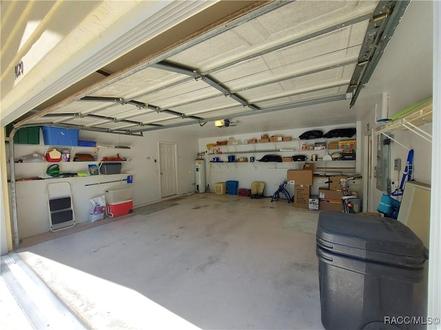 9120 SW 193rd Cir, Dunnellon, FL 34432 - garage featuring a garage door opener and water heater