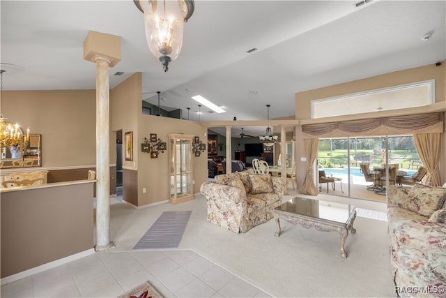 living room with light carpet, decorative columns, ceiling fan, and lofted ceiling