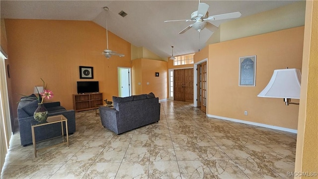 living room with ceiling fan and high vaulted ceiling