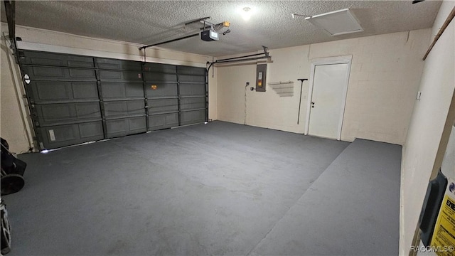 garage featuring a garage door opener and electric panel