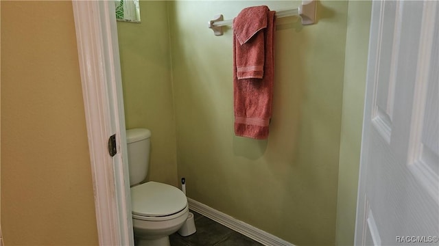 bathroom featuring tile patterned floors and toilet