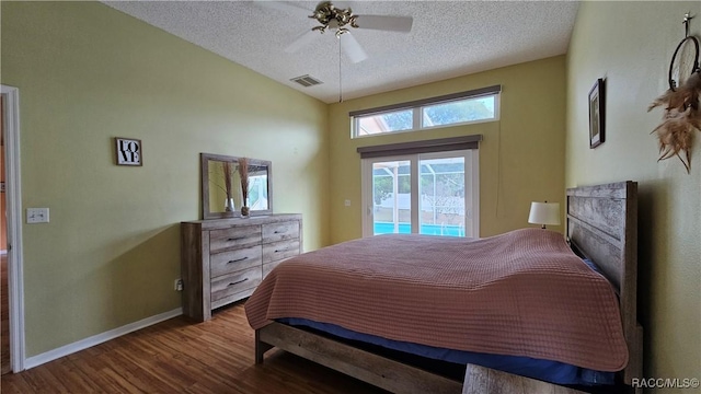 bedroom featuring hardwood / wood-style flooring, ceiling fan, access to outside, and a textured ceiling