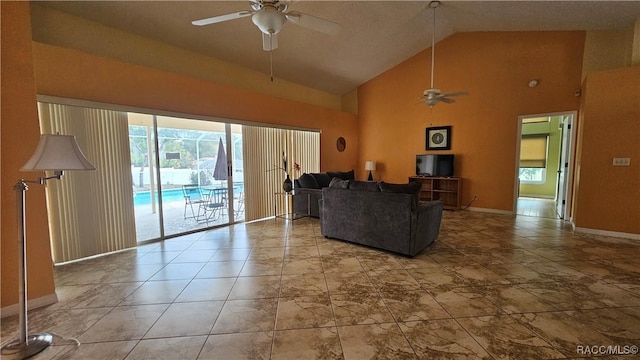 living room with high vaulted ceiling and ceiling fan