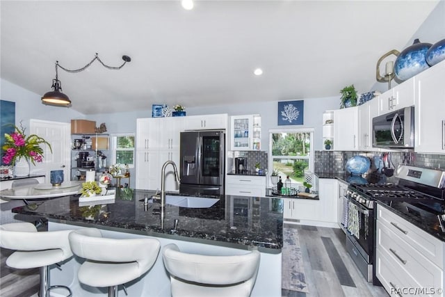 2247 S Waterman Dr, Crystal River, FL 34429 - kitchen with stainless steel appliances, a sink, decorative backsplash, white cabinetry, and recessed lighting