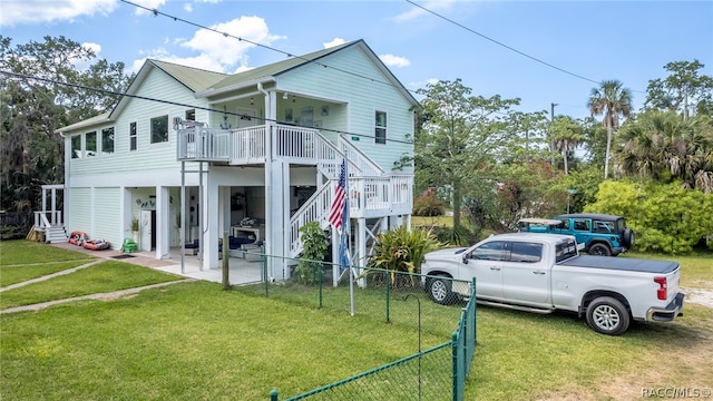 exterior space featuring a porch and a lawn