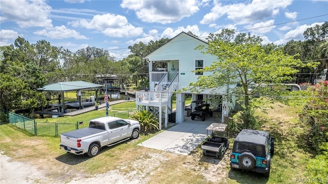 view of front of home featuring covered porch and a carport