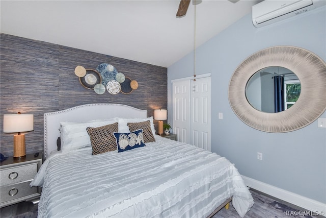 bedroom with a wall mounted AC, ceiling fan, dark wood-type flooring, and lofted ceiling