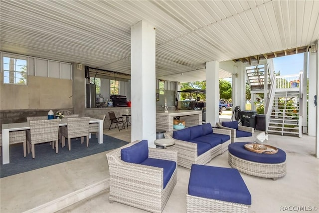2247 S Waterman Dr, Crystal River, FL 34429 - view of patio with an outdoor hangout area, stairway, and a bar