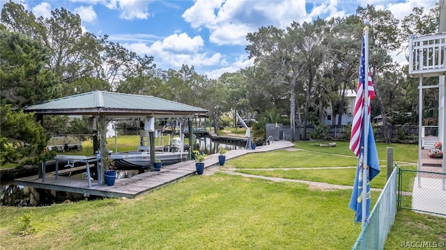 dock area featuring a yard and a water view