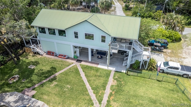 exterior space with a yard, a carport, and a wooden deck