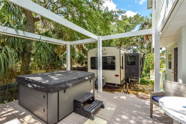 deck featuring a hot tub