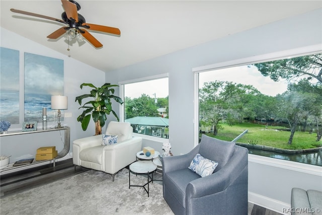 sunroom with ceiling fan and lofted ceiling