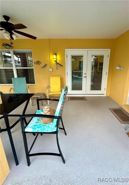 3495 W Wilburton Dr, Citrus Springs, FL 34433 - sunroom / solarium featuring french doors