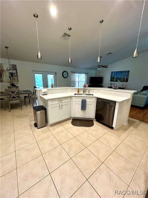 3495 W Wilburton Dr, Citrus Springs, FL 34433 - kitchen with black dishwasher, open floor plan, lofted ceiling, light tile patterned floors, and light countertops