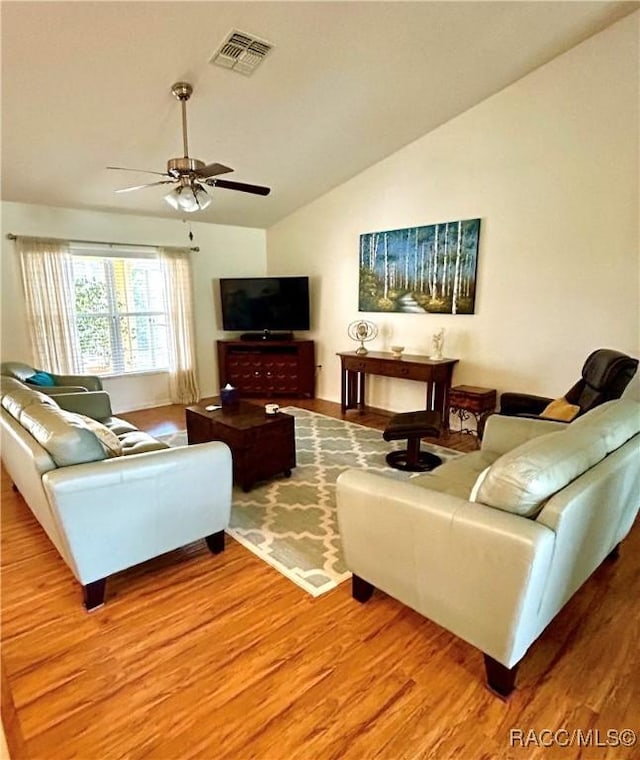 3495 W Wilburton Dr, Citrus Springs, FL 34433 - living area featuring lofted ceiling, wood finished floors, and a ceiling fan